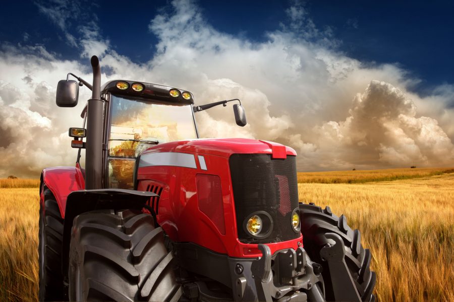 New Modern Tractor on the Barley Field in Sunset Light, Photomontage. See more pictures from my lightbox 